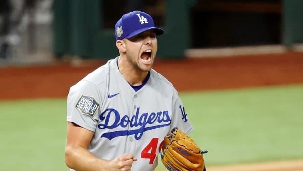Oct 25, 2020; Arlington, Texas, USA; Los Angeles Dodgers relief pitcher Blake Treinen (49) reacts after striking out Tampa Bay Rays shortstop Willy Adames (not pictured) to end the ninth inning of game five of the 2020 World Series at Globe Life Field. The Los Angeles Dodgers won 4-2. Mandatory Credit: Kevin Jairaj-USA TODAY Sports